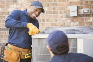 smiling-HVAC-technician-at-work
