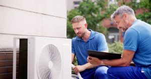 technicians-repairing-outdoor-AC-unit